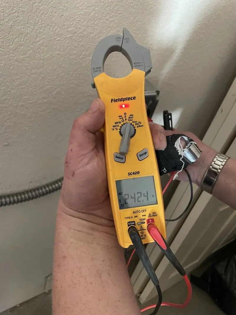 Voltage testing with clamp meter during Whole House Surge Protector in Friendly